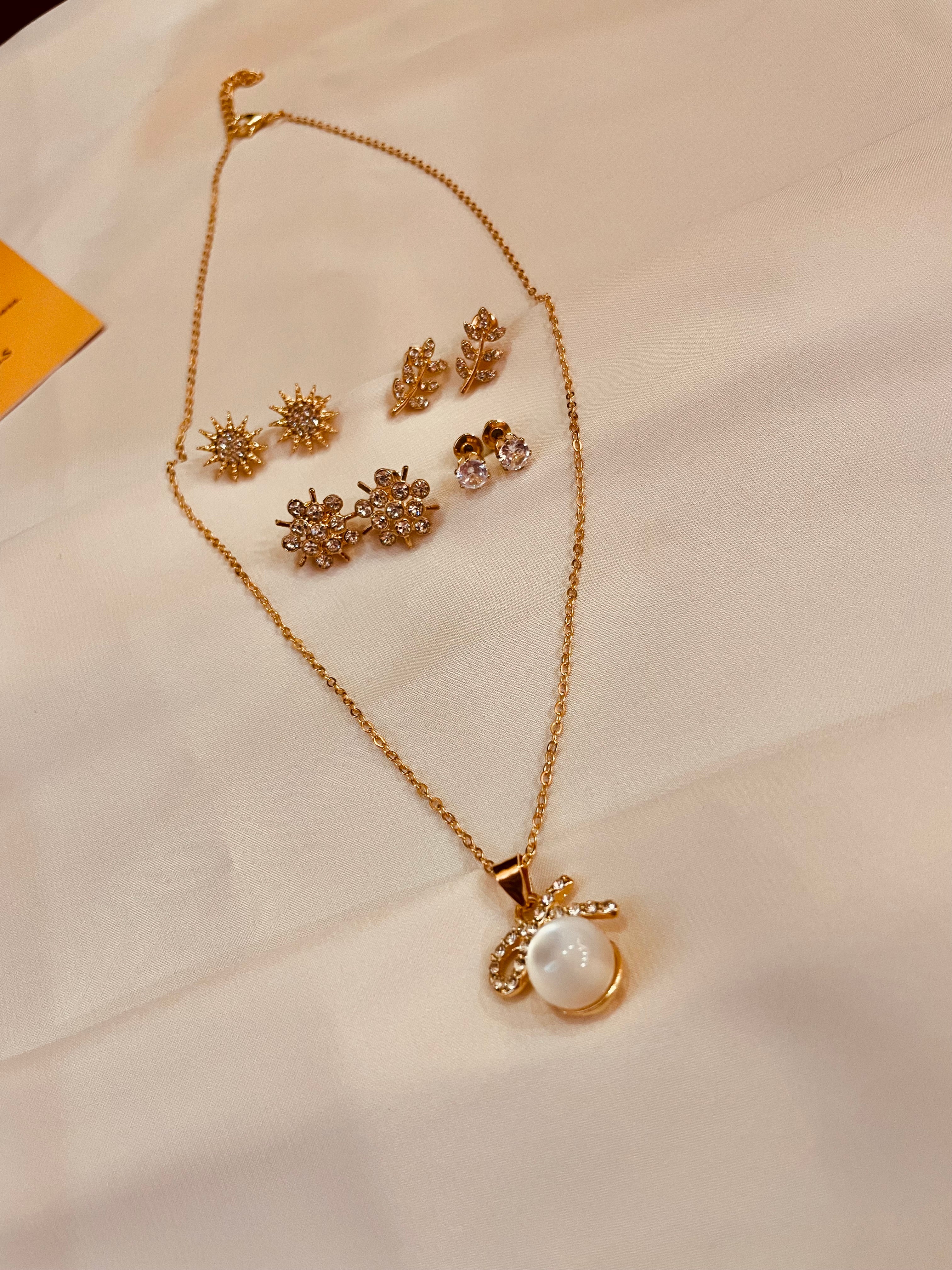 Bow Pearl Pendent Set With Four Interchangeable Stud's